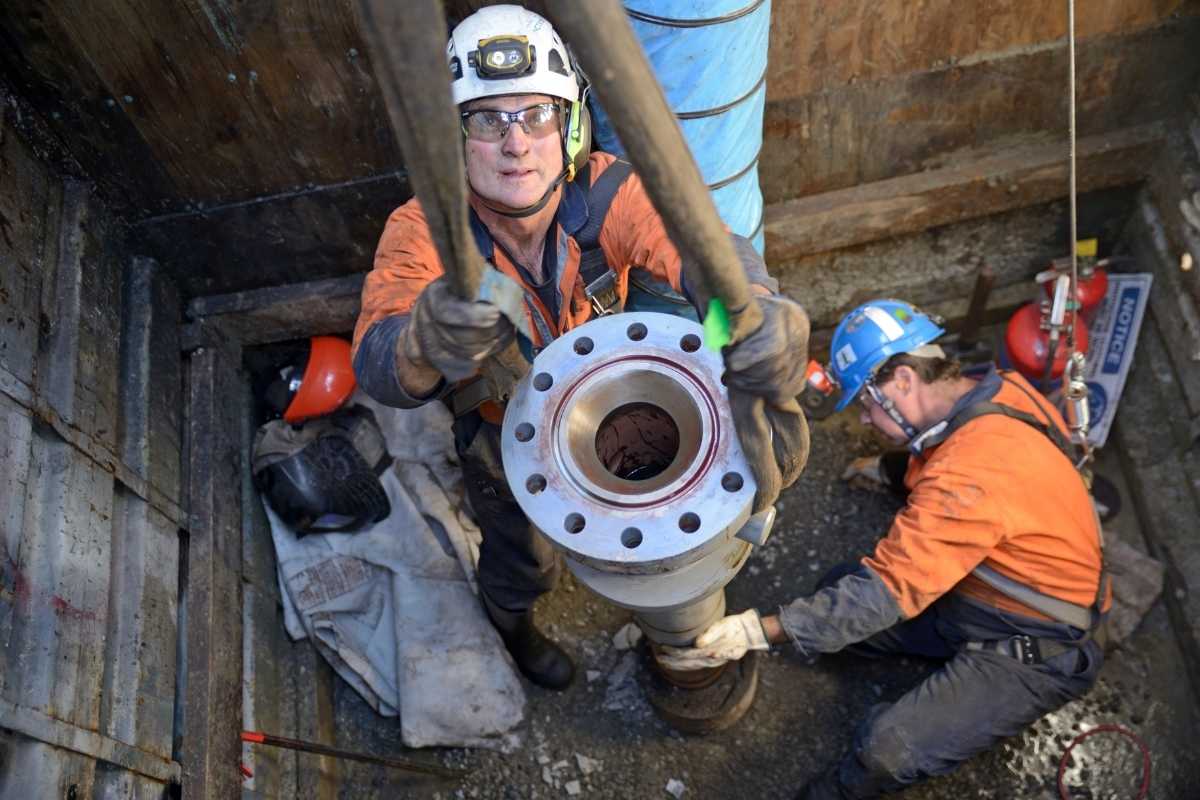 workers installing a pipe