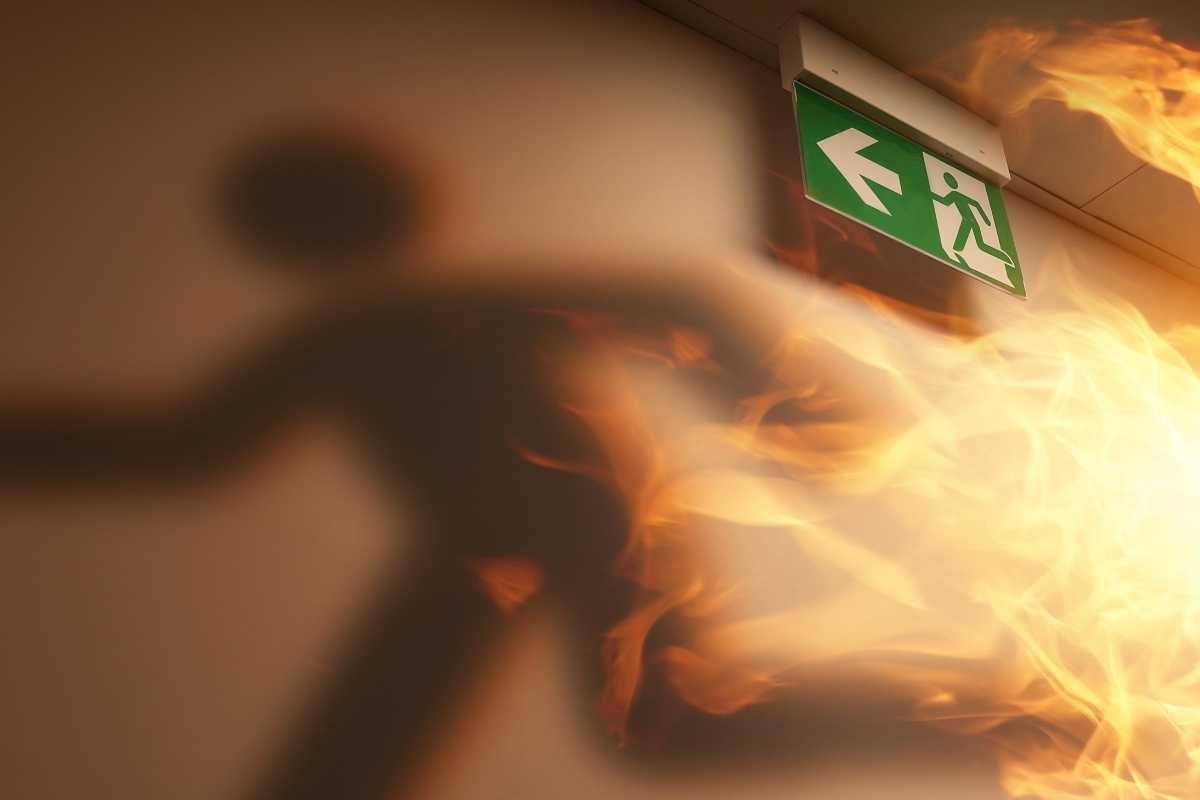 running man in burning corridor